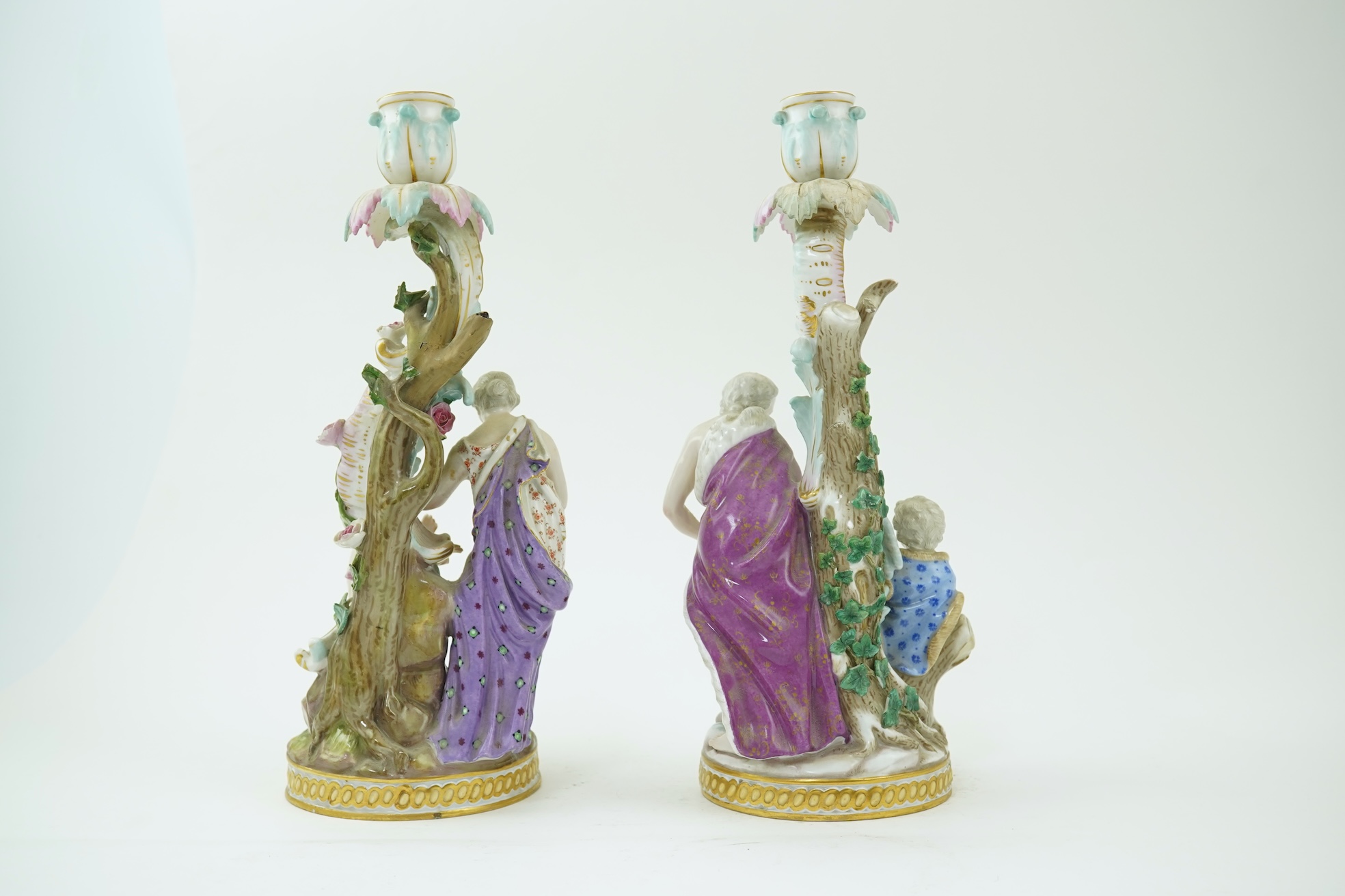 A near pair of Meissen figural candlesticks, late 19th century